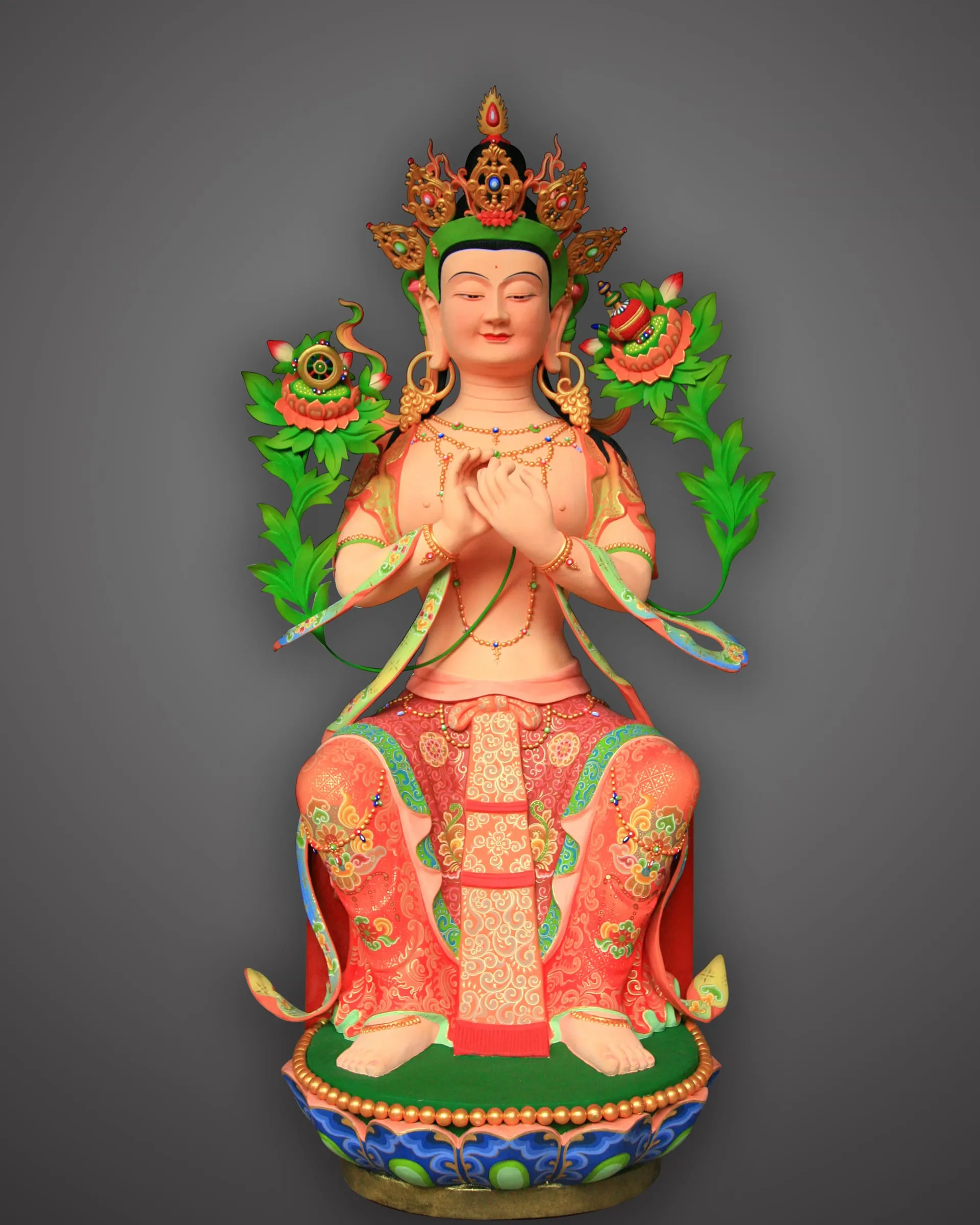 Painted Maitreya with a green and gold crown, seated on a lotus base.